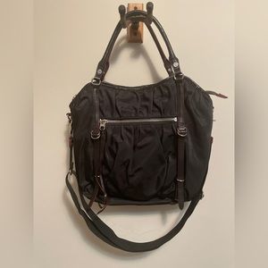 MZ Wallace black nylon cargo bag with leather trim and tassels